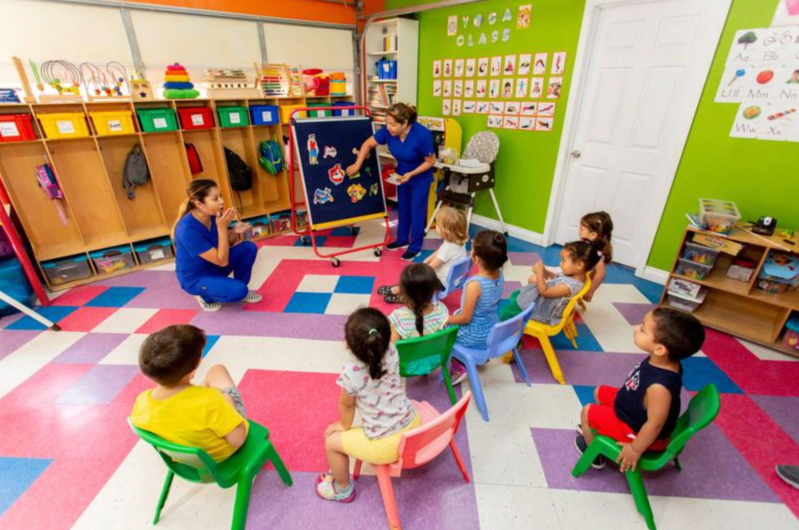 WeeCare daycare providers instructing students in the classroom.